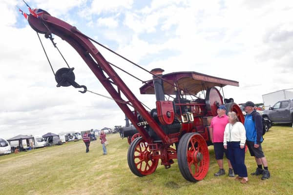L-R John Foxton and Caroline Foxton of Frithville, Dave Webster of Bicker, looking at a Burrell and Sons steam crane 'The Lark', owned by Robert Crawford of Frithville