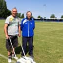 Jim Ely, left, pictured helping Boston Town secretary Eddie Graves with pitch maintenance in 2015.