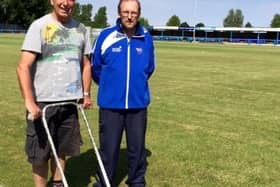 Jim Ely, left, pictured helping Boston Town secretary Eddie Graves with pitch maintenance in 2015.