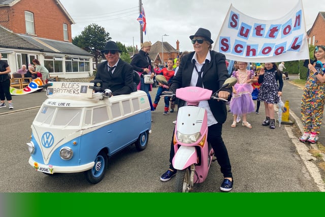 Teachers and pupils from Sutton on Sea School led by Mr and Mrs Creamer dressed as the Blues Brothers.