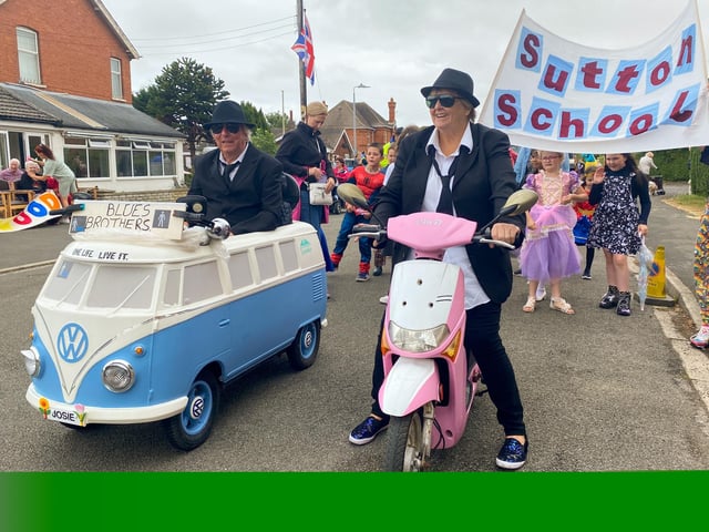 Teachers and pupils from Sutton on Sea School led by Mr and Mrs Creamer dressed as the Blues Brothers.