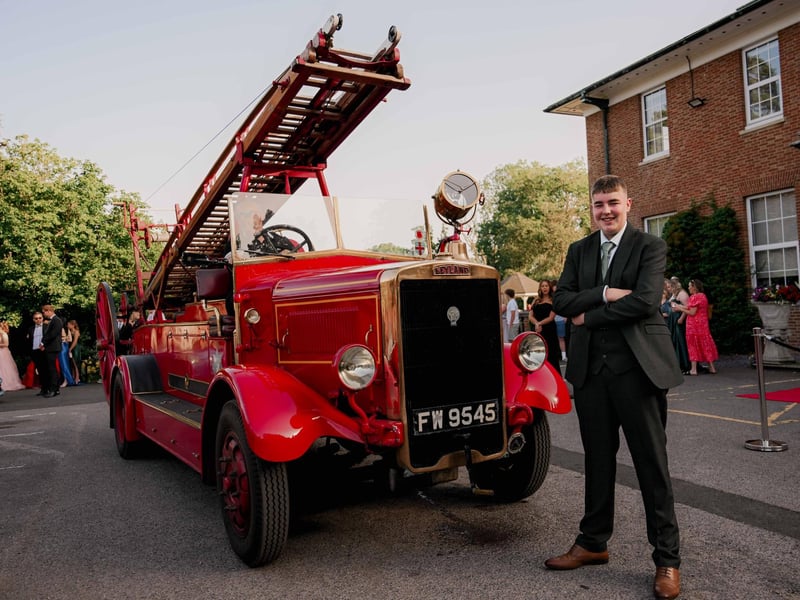 A memorable arrival by vintage fire engine.