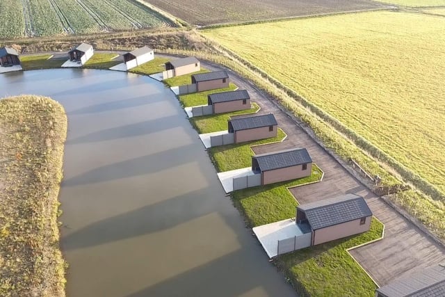 An aerial shot of the lakeside lodges