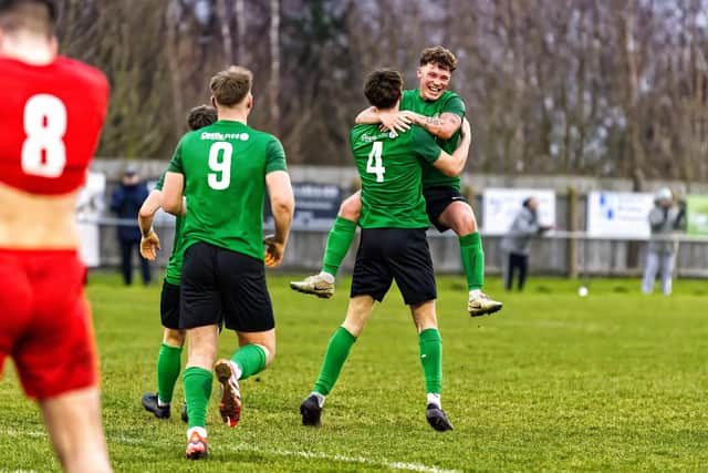 Sleaford celebrate after Ben Robson (no.4) scored against Heanor. Photo: Steve W Davies Photography.