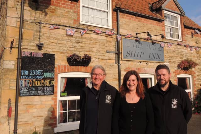 saved - The Old Ship Inn at Pointon. From left – Tony Pygott – director, Jan Antink – bar manager, and Tony Carter, brewery pub manager.
