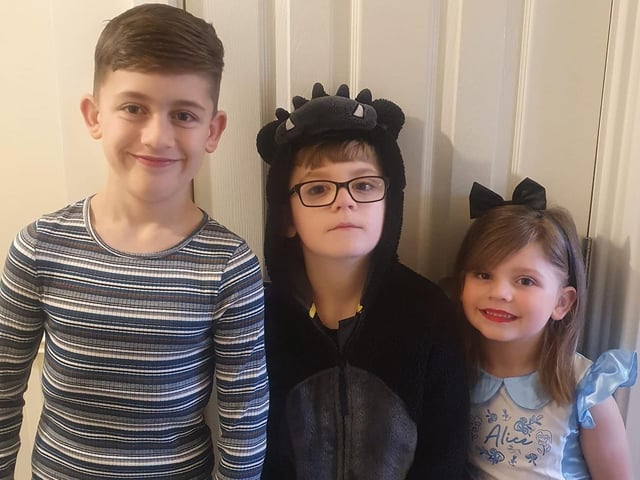 Siblings dressed as different book characters ready for World Book Day.