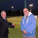 Mayor of Sleaford Coun Anthony Brand cuts the ribbon on the new floodlight system for Sleaford tennis Club, with club chairman Dr Stuart Clegg.