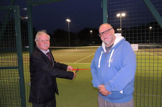 Mayor of Sleaford Coun Anthony Brand cuts the ribbon on the new floodlight system for Sleaford tennis Club, with club chairman Dr Stuart Clegg.