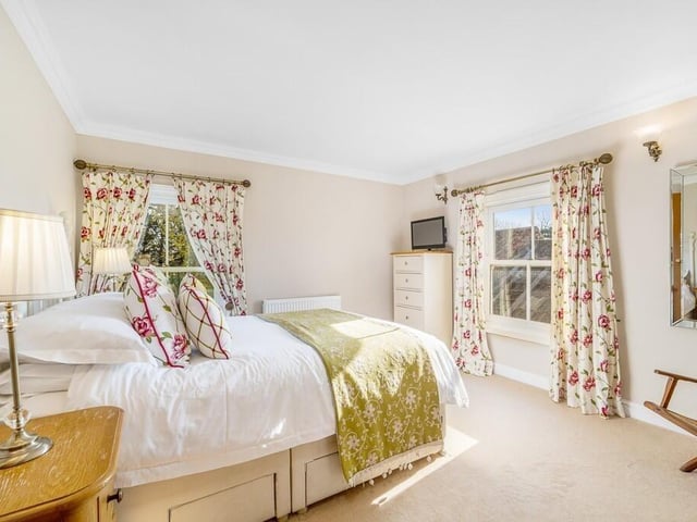 One of the other first-floor bedrooms and ...