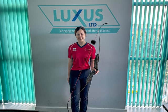 GOING FOR GOLD: Natalie Stones in her archery attire at Luxus Ltd, her employer and sponsor.