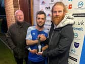 Kallum Smith receive his man of the match award after Boston Town's victory against AFC Mansfield