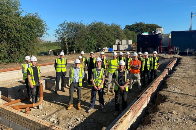 Steve Gelder (third from left) with 16 Gelder Group apprentices on site at Sturton by Stow