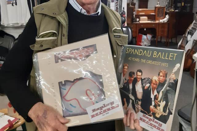 Norman with the two vinyls donated by Replay Records.