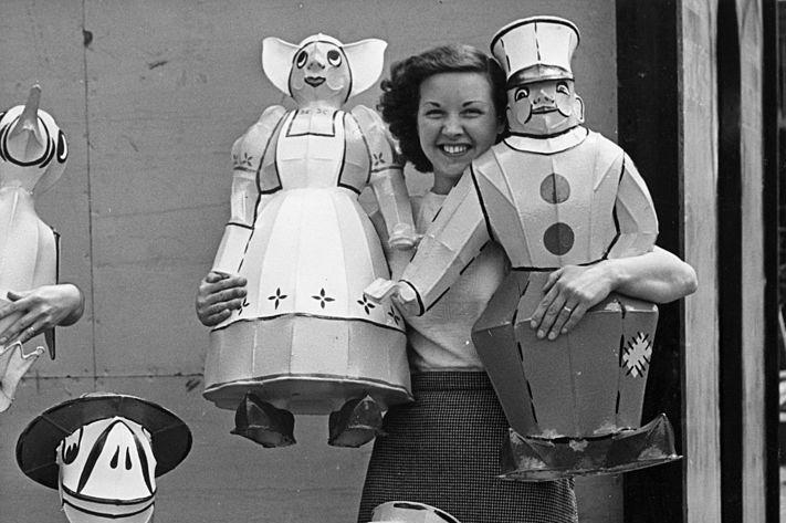 Kathryn Hall, an employee of the Franco-British Electrical Co Ltd of Hendon, with a selection of illuminated Fairy Folk the company has designed for Skegness Urban District Council on 19th June 1953 They formed part of an illuminated display in the Tower Gardens.