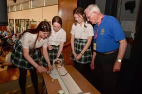 Kesteven and Sleaford High school pupils, from left - Alisha Siddy, 14, Eva Shaw, 15 and Leah Scott, 15, with Bill Martindale of the Rotary Club.