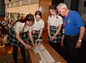 Kesteven and Sleaford High school pupils, from left - Alisha Siddy, 14, Eva Shaw, 15 and Leah Scott, 15, with Bill Martindale of the Rotary Club.