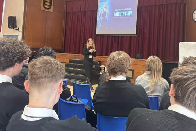 Speaking to students in the main hall.