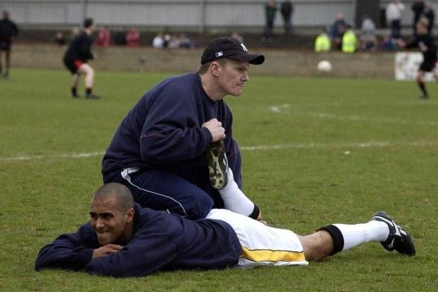 Jim Woods gets Mark Clifford ready for action.