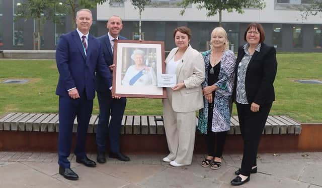 Councillor Tim Mitchell, Councillor Rob Waltham, Holly-Mumby-Croft MP, Councillorr Elaine Marper and Councillor Julie Reed with the plaque at the official renaming of Church Square. Image: North Lincolnshire Council