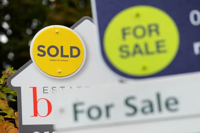 EMBARGOED TO 00001 TUESDAY OCTOBER 26 File photo dated 14/10/14 of estate agents boards. The housing market is set to record its highest level of sales this year since 2007, according to a property website. Issue date: Tuesday October 26, 2021.
