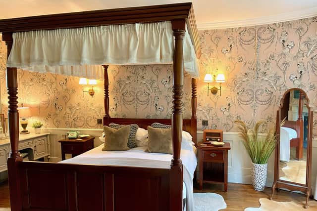 The ‘Romantic’ room with its four-poster bed
