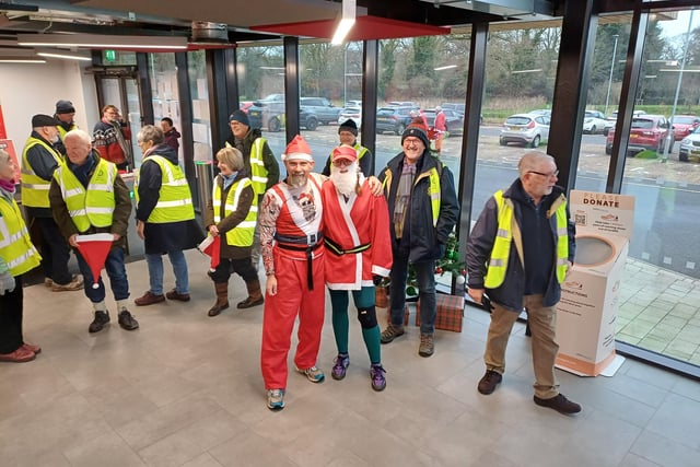Rotarians gathered to act as stewards and help keep the Santas on track