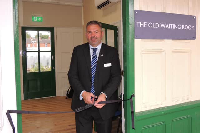 Coun Richard Wright declares the restored waiting room open for the community.
