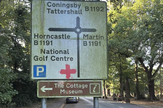 A Cross of St George symbol has been painted on this road sign in Woodhall Spa.