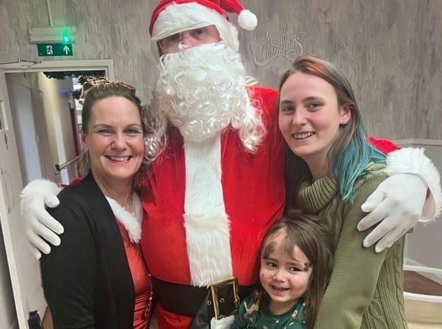 Santa with Hayley, Issac and Phoebe Peace .