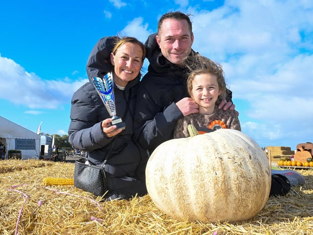 Sabrina and Scott Mackey, with Matilda Mackay, eight, of Highgate Nursery, Leverton, with their prize-winning pumpkin. The specimen was the heaviest submitted in the schools and nurseries class.