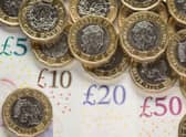 What is the National Living Wage and what is the minimum hourly rate of pay currently in the UK in 2022?