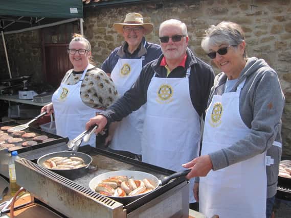 Market Rasen Rotarians were kept busy serving sausages at Open Farm Sunday.