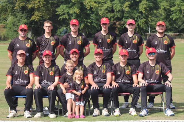 Horncastle Cricket Club's Hundred team, with 'mascots' Rory and Elsie Bee (centre).