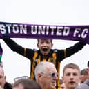 A young Boston United fan shows his colours.