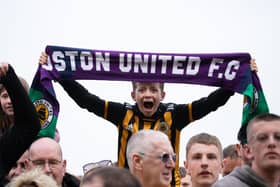 A young Boston United fan shows his colours.