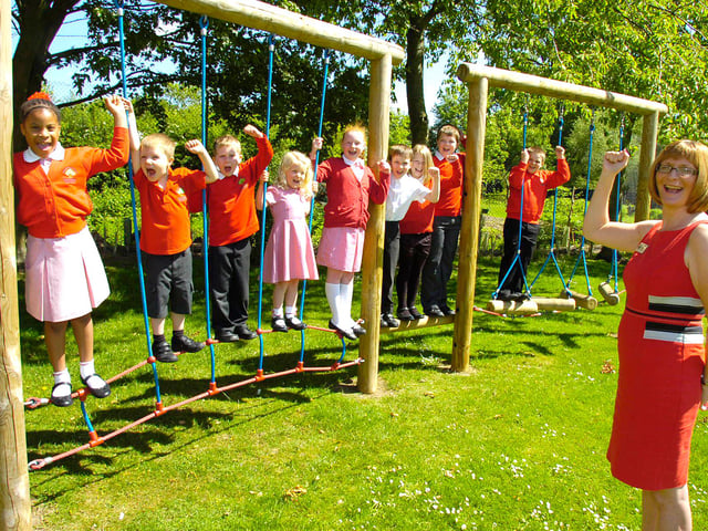 Chestnut Street CofE Primary School, in Ruskington, was celebrating 10 years ago after being rated as 'good' in its latest Ofsted inspection. Pictured alongside pupils is head teacher Laura Suffield.