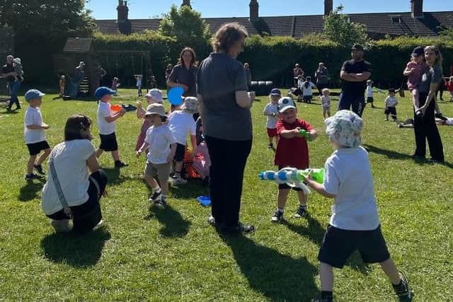 Squirting water guns on the sponsored toddle.
