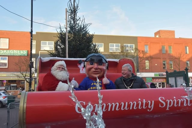 Ho, ho, ho - Santa in his sleigh outside the Hildreds Centre gets a visit from Mayor Coun Pete Barry and the Jolly Fisherman.