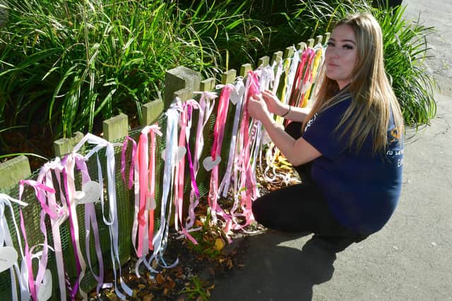 Kelsey Hiom pictured at the launch of the ribbons project on Monday, before several were ripped off.