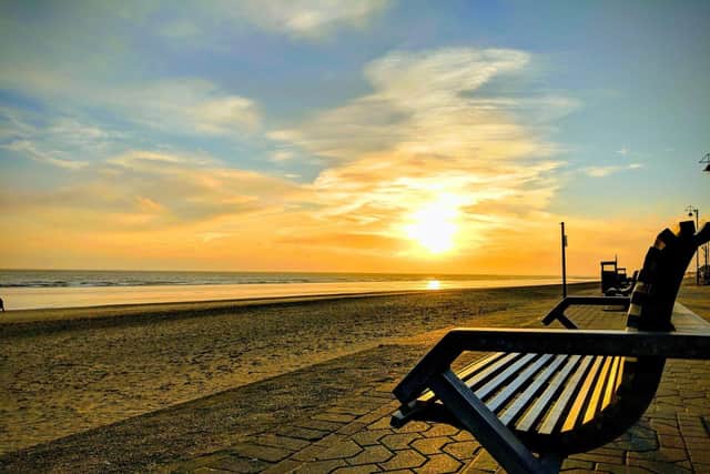 Bench at sunset by the beach