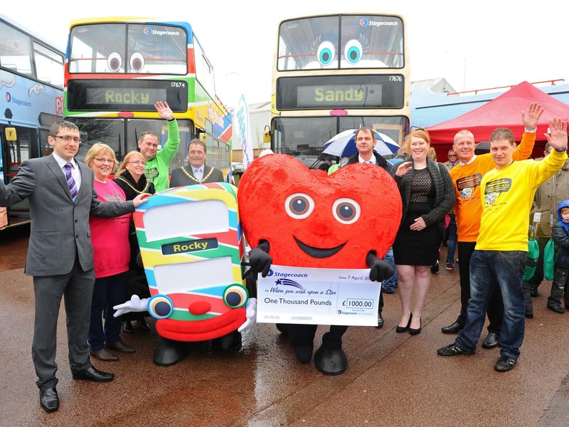 Stagecoach launching a new, colourful fleet of open-top buses for Skegness. The Seasiders, at that time, were Rocky, Shelly, Candy, Pierre and Sandy, however Skegness Standard readers were being asked to design a sixth member. The revamp included new livery, refurbished seats and interiors, an accompanying children’s storybook and offers. It was part of the bus company’s efforts to support the local tourism industry and provide fun holiday-themed accessible public transport for residents and visitors to Skegness. Sales of the Rocky Seasider storybook would raise money for the When You Wish Upon a Star charity. As part of the launch event, Stagecoach presented the charity with a £1,000 donation.