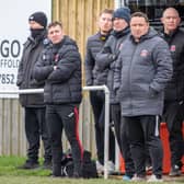 Skegness Town manager Chris Rawlinson (centre) is keen to see his side register their first win of the campaign.