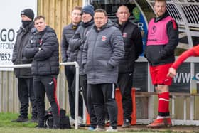 Skegness Town manager Chris Rawlinson (centre) is keen to see his side register their first win of the campaign.