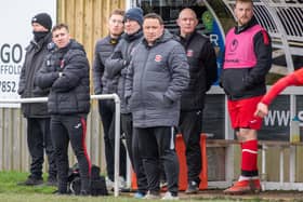 Skegness Town manager Chris Rawlinson (centre) is keen to see his side register their first win of the campaign.