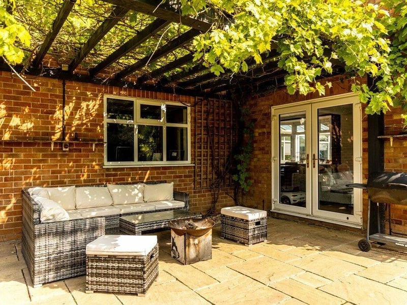 A terraced area with pergola.