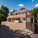 The front of the home and its gated access.