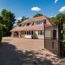 The front of the home and its gated access.