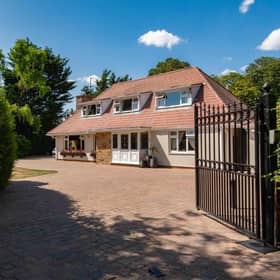 The front of the home and its gated access.