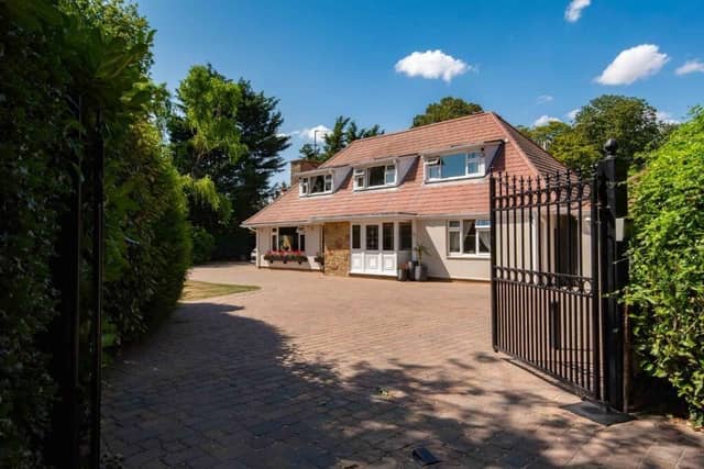 The front of the home and its gated access.