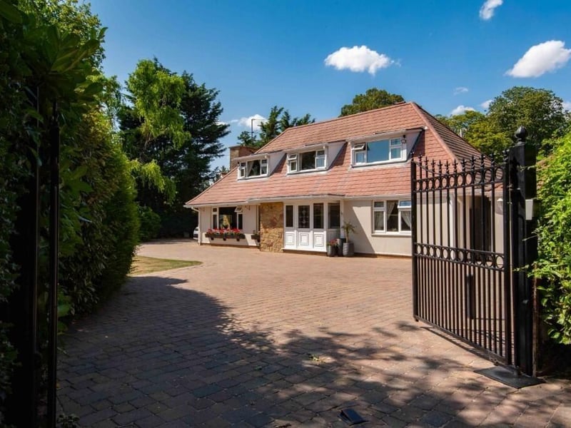 The front of the home and its gated access.